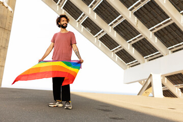 Happy man with a pride flag. LGBT community