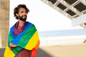 Happy man with a pride flag. LGBT community - obrazy, fototapety, plakaty