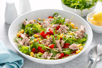 Canned tuna salad with arugula and fresh vegetables