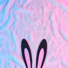 Rabbit Bunny ears like symbol of new year 2023 on fur background in vibrant gradient holographic...