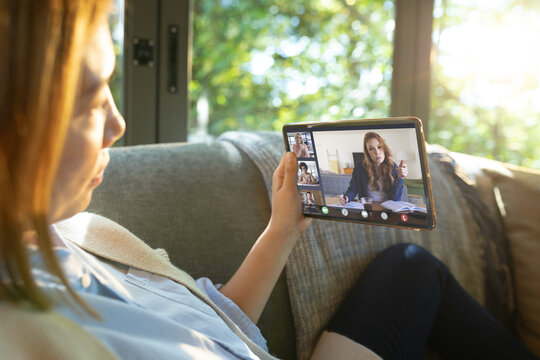 Asian businesswoman having video call with colleagues