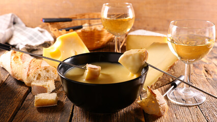 cheese fondue with bread and wine