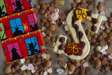 Dutch Sinterklaas tradition:A chocolate letter, a present and candy called Pepernoten.