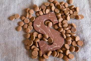 Dutch Sinterklaas tradition: A chocolate letter and candy called Pepernoten.