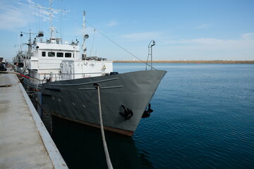Naklejka premium Aktau / Kazakhstan - 08.16.2018 : Military ship moored in the sea port