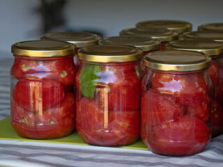 Jar of homemade peeled tomatoes. Traditional Italian food