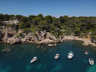 Aerial view of Cap d'Antibes and  Billionaire's Bay. Beautiful rocky beach near coastal path on the Cap d'Antibes, Antibes, France. Drone view from above of C&ocirc;te d&rsquo;Azur near Juan-les-Pins and Cannes.