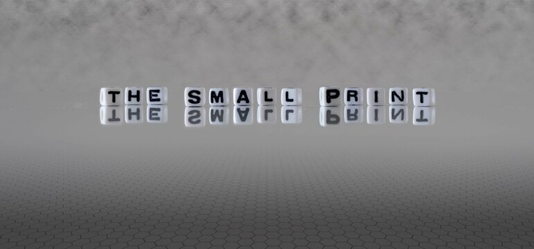 the small print word or concept represented by black and white letter cubes on a grey horizon background stretching to infinity