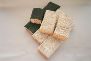 tempeh Tempe is Indonesian traditional food made from fermented soybeans. They are usually wrapped in banana leaves.