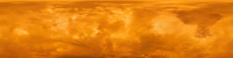 Golden glowing red orange overcast sunset sky panorama. Hdr seamless spherical equirectangular 360 panorama. Sky dome or zenith for 3D visualization and sky replacement for aerial drone 360 panoramas.
