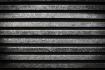 Texture of horizontal lines and gray and black colors with the grunge weathered surface