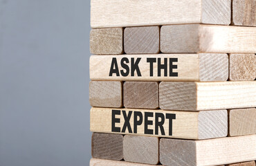 The text on the wooden blocks ASK THE EXPERT