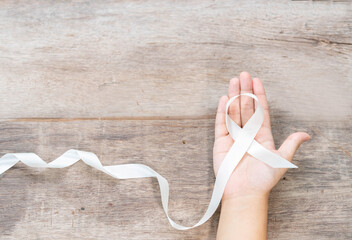 White ribbon oncept of international day of non-violence.