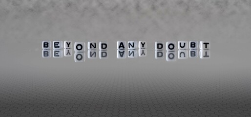 beyond any doubt word or concept represented by black and white letter cubes on a grey horizon...