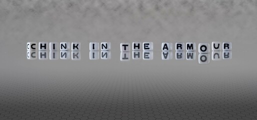 chink in the armour word or concept represented by black and white letter cubes on a grey horizon...