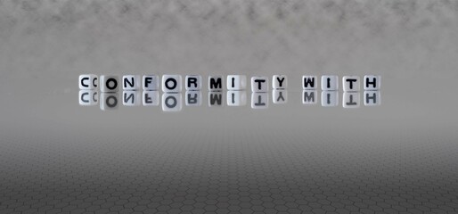 conformity with word or concept represented by black and white letter cubes on a grey horizon...