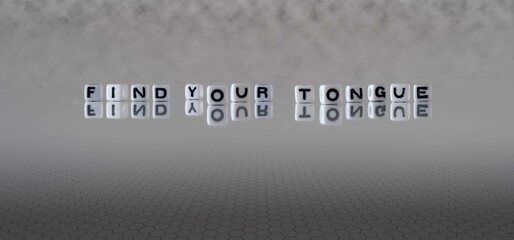 find your tongue word or concept represented by black and white letter cubes on a grey horizon...