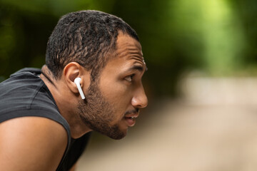 Profile portrait of black guy sportsman looking at copy space