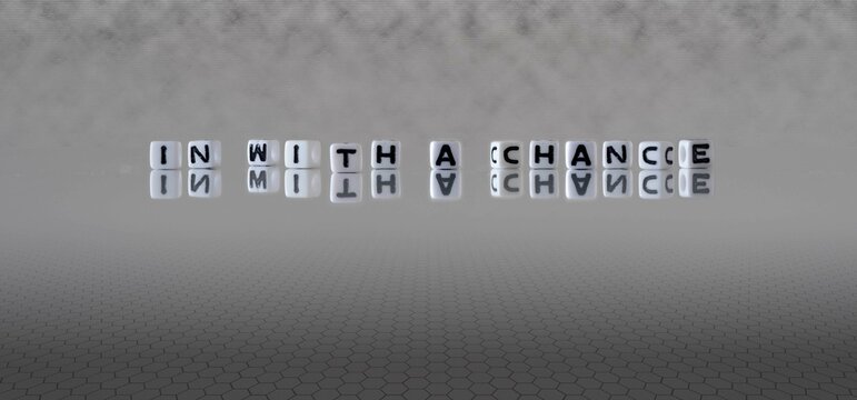 in with a chance word or concept represented by black and white letter cubes on a grey horizon background stretching to infinity