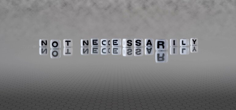 not necessarily word or concept represented by black and white letter cubes on a grey horizon background stretching to infinity