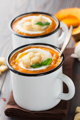 Orange Autumn Homemade Pumpkin Cream Soup, croutons and Basil