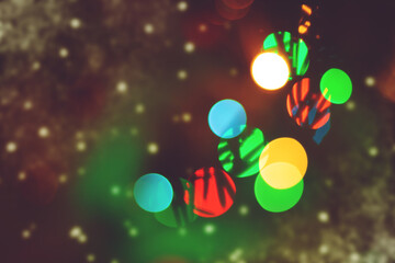 Festive background with blurred lights. A postcard on the theme of winter holidays.