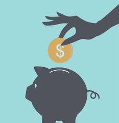 Obraz premium hand putting money into piggy bank 