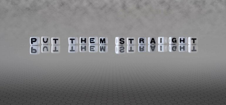 put them straight word or concept represented by black and white letter cubes on a grey horizon background stretching to infinity