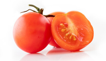 Fresh cherry tomatoes on a white background