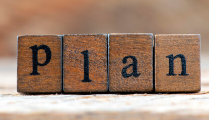 Word plan arranged from wooden letters. Time for new plans in business and life.