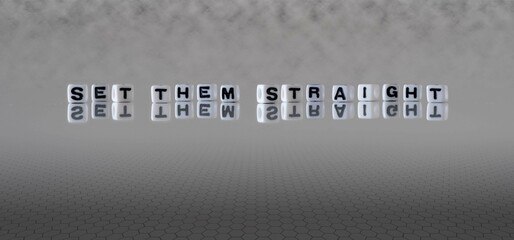 set them straight word or concept represented by black and white letter cubes on a grey horizon...