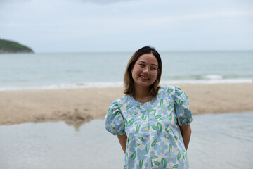 Beautiful young pregnant woman walking on the beach feel peace