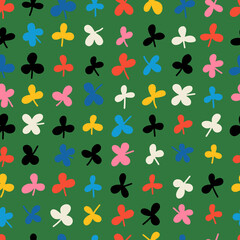 Seamless colorful clover leaves pattern. Abstract background with hand drawn doodle shapes. 