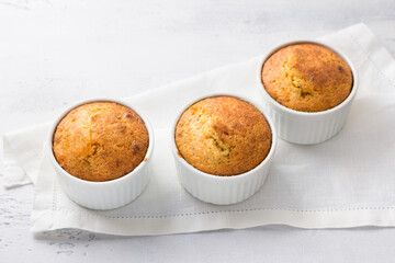 Freshly baked delicious carrot mannik with nuts on a light blue background, top view. Delicious homemade food