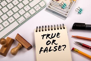 True or False? Money and stationery on a white office table