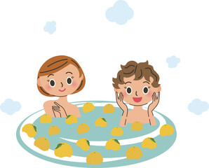 柚風呂に入っている2人の女性
