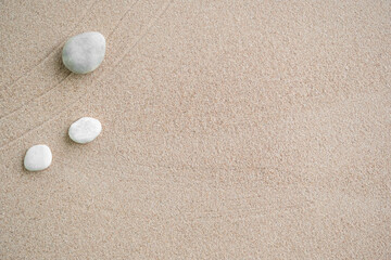 Fototapeta na wymiar Japanese Zen Garden with Pebble with Line on Sand.mini Stone on Beach backgrond Top View and nobody.Ciircle Rock Balance Japan on nature.Simplicity Purity life.Relax Aromatherapy Spa and Yoga.Buddhism
