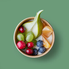 fresh fruit and berries in paper cup