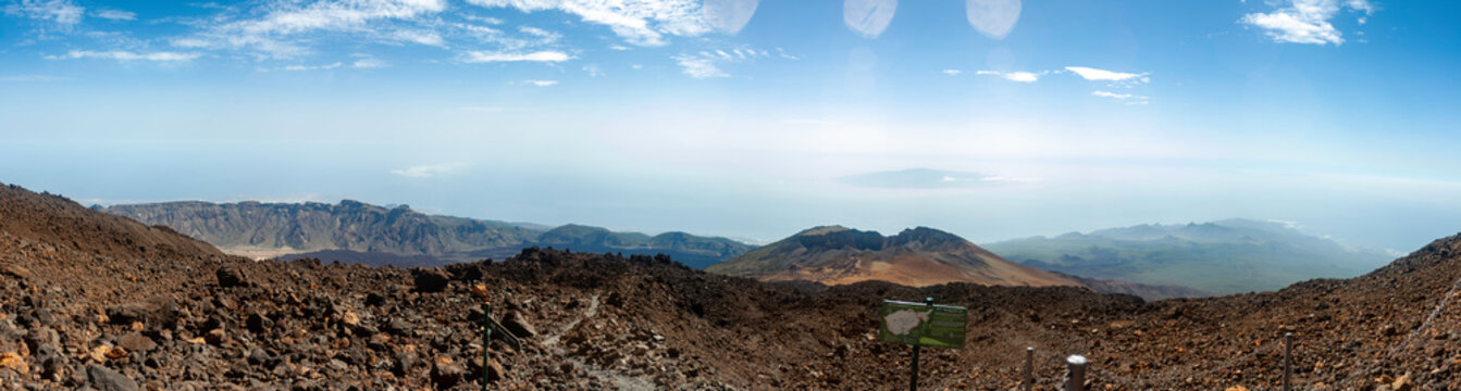 Pico Viejo volcano with the island of La Gomera in the background, image taken from a viewpoint on Teide, Tenerife, Spain