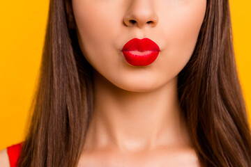 Close up cropped portrait of adorable pretty girl pouted lips kiss isolated on yellow color background