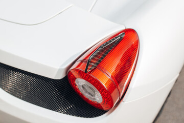 Modern supercar carbon spoiler wing at the trunk