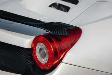 Modern supercar carbon spoiler wing at the trunk