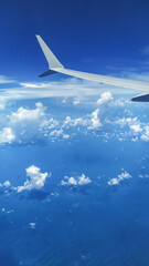 Fototapeta na wymiar View from an Airplane during flight with clouds