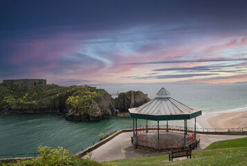 Tenby  band  stand   on sunset  evening  with  the  fort of   St  Catherine   Pembrokeshire 