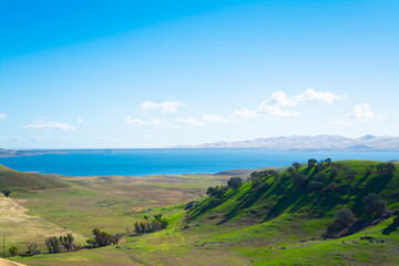 Fototapeta na wymiar San Luis Obispo reservoir under a blue sky