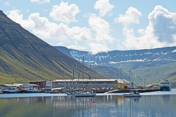 Fototapeta na wymiar Images of the town of Isafjordur in Iceland which is surrounded by water and dramatic scenery