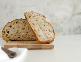 Sourdough bread with black olives on the white background. Copy space for text 