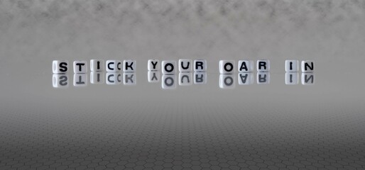 stick your oar in word or concept represented by black and white letter cubes on a grey horizon...