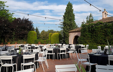 Outdoor venue with dinner tables before event
