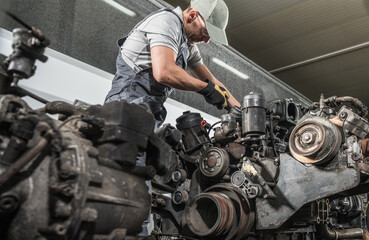 Truck Mechanic Rebuilding Truck Diesel Engine © Tomasz Zajda
